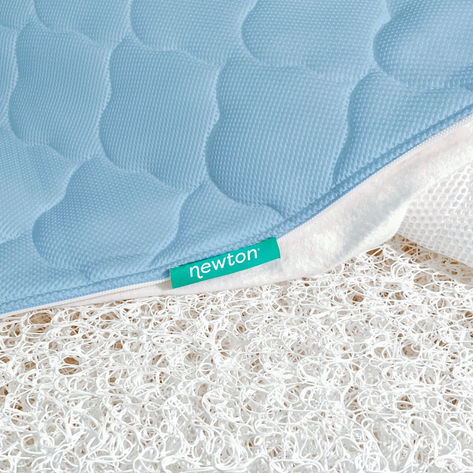 close up of newton mattress cover and innovative newton wovenaire core