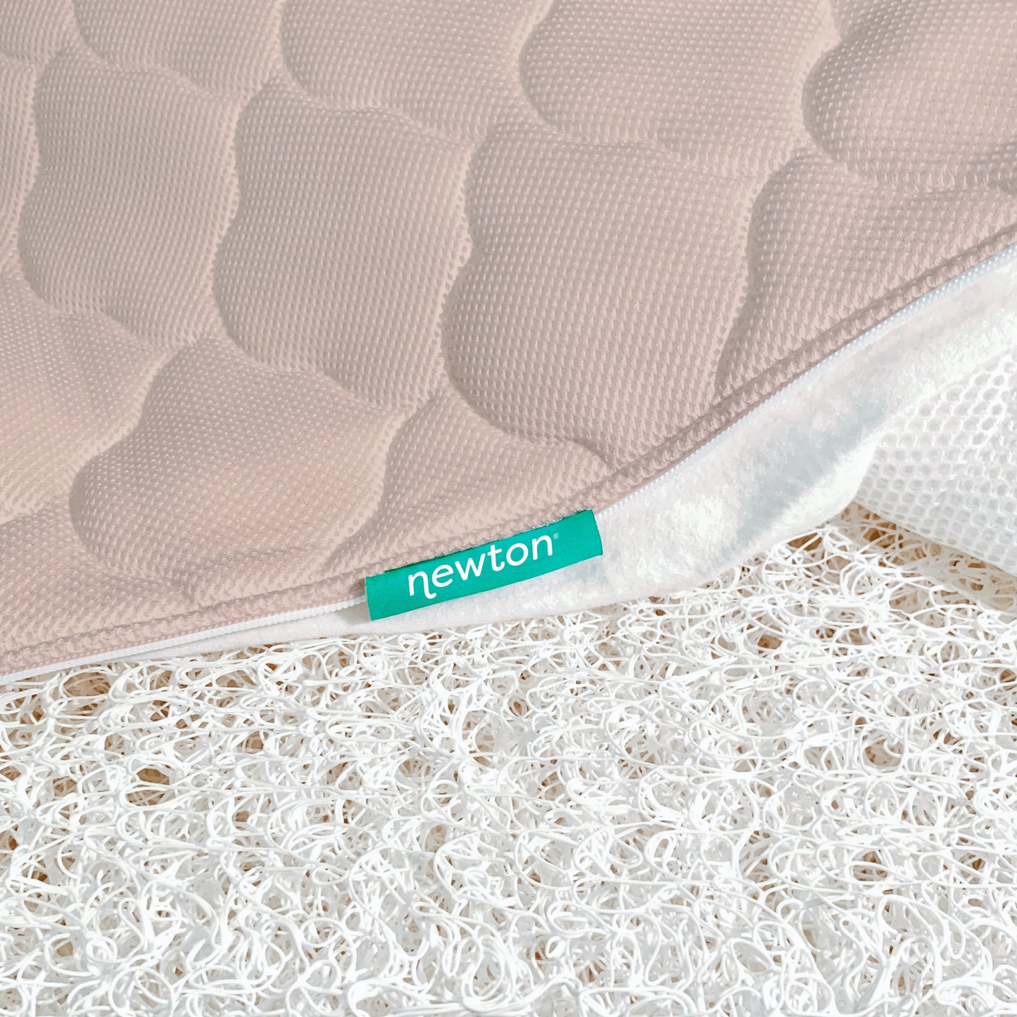 close up of newton mattress cover and innovative newton wovenaire core