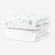 A stack of two bvaby crib sheets featuring a top sheet with a light blue star pattern on a white background, set against a plain white background. skip