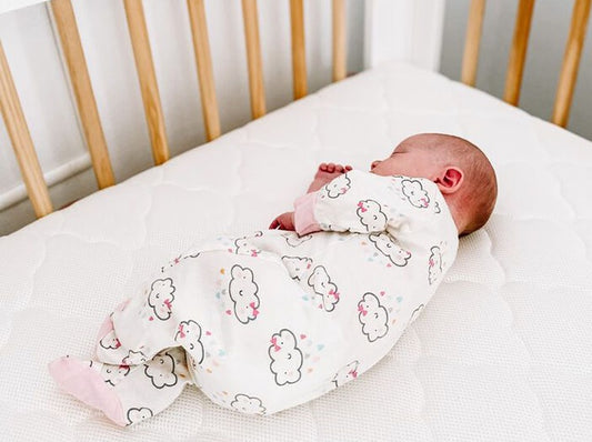 baby rolling over in crib