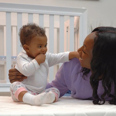 Baby sitting on greenguard gold certified mattress