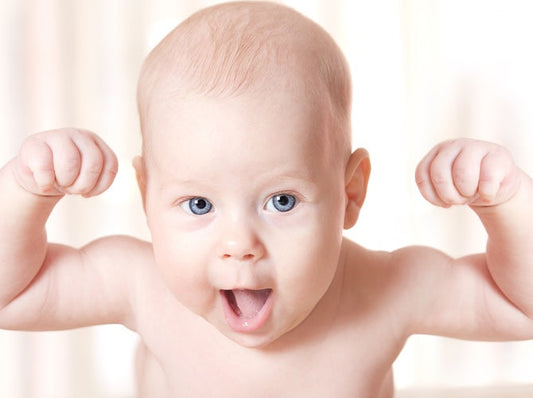 baby showing off arms from growth spurt