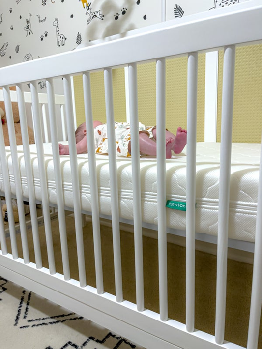 baby laying in crib