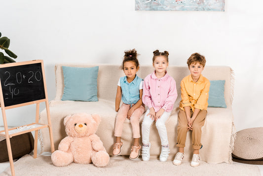 kids sitting on a play couch