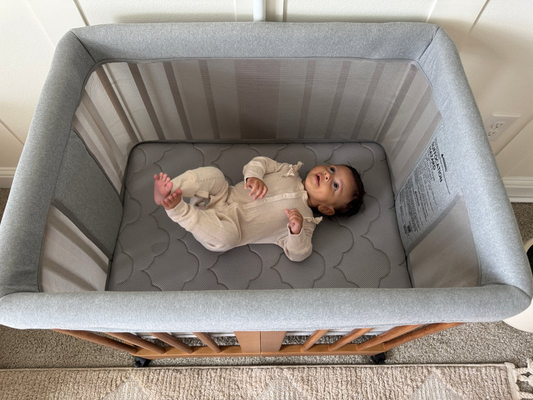 baby laying in bassinet that is having sleep regression