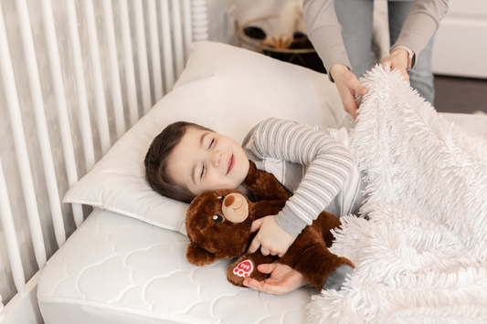 Kid hugging his toddler pillow