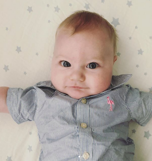 baby laying down staring up at you