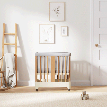 Gif of Natural + Dover White color Newton Nest Convertible Crib in all of its different possible conversions, in a beautiful nursery 999-8440-NDW-C1