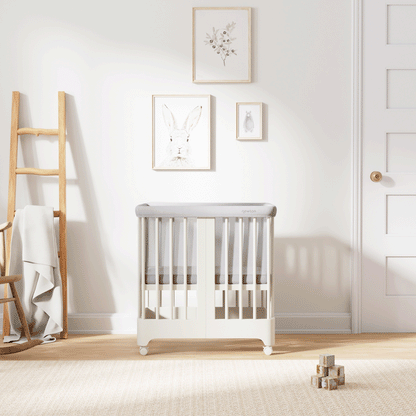 Gif of warm white color Newton Nest Convertible Crib in all of its different possible conversions, in a beautiful nursery 
999-8440-WRW-C1