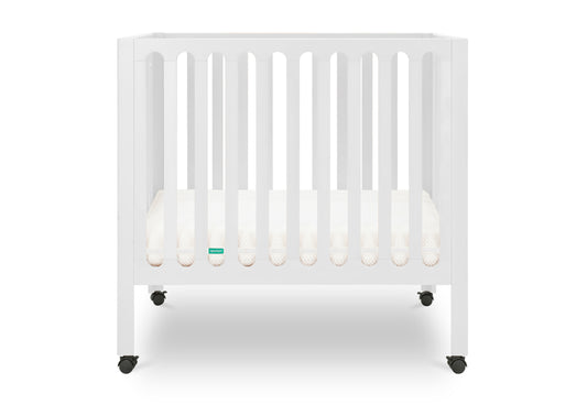 White modern baby crib with a thin mattress on wheels. 999-8430-WHT