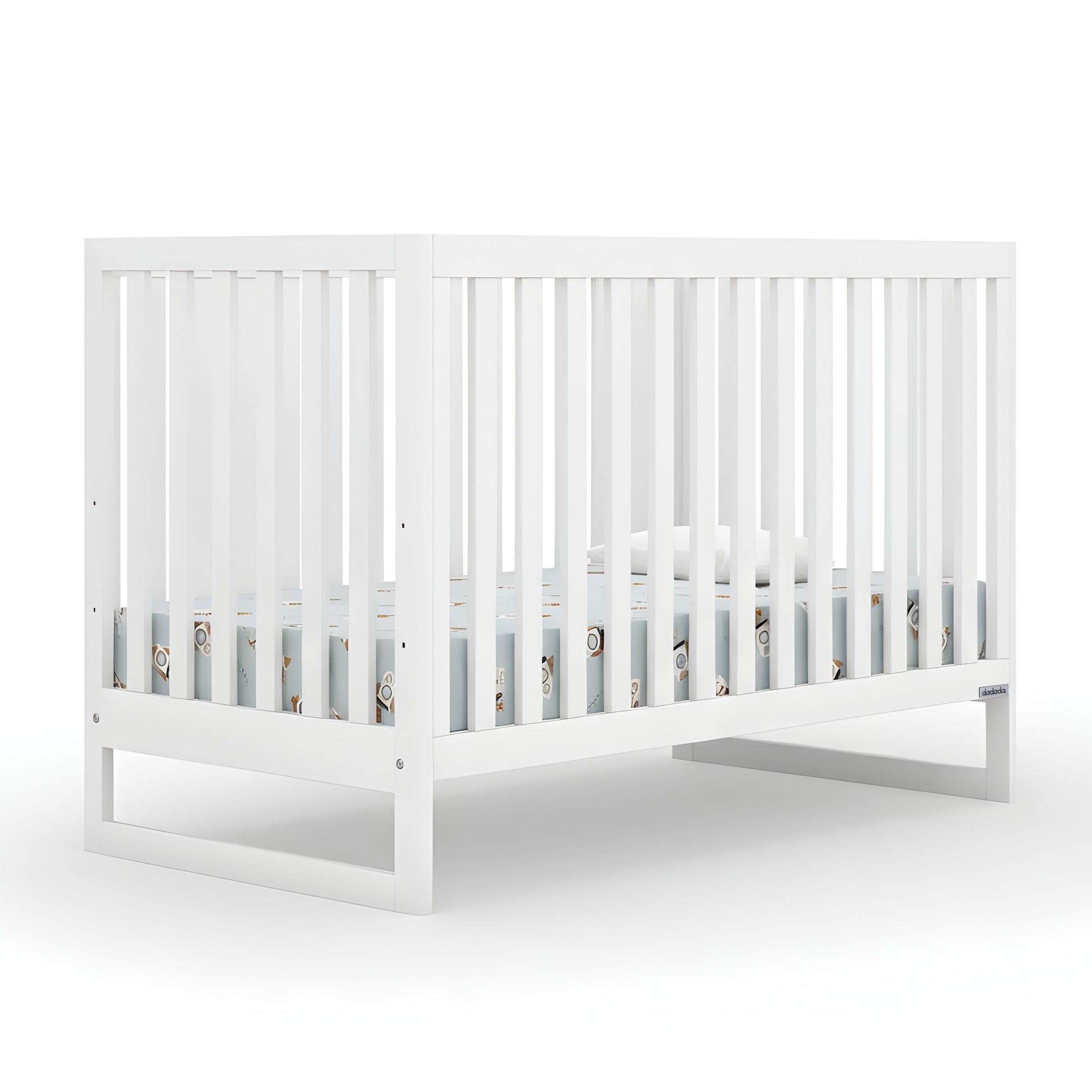The Austin Convertible Crib by dadada baby is a white, sustainably crafted beechwood 3-in-1 crib with vertical slats and modern design, shown with a light blue Newton crib mattress against a plain white background. 500-8200-WHT