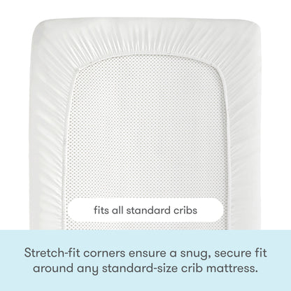 The Newton Baby Essential Waterproof Crib Pad is shown with stretch-fit corners snugly covering a crib mattress. Text reads: Fits all standard cribs and features a waterproof liner for added protection and a secure fit.