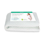 A folded Newton Baby Essential Waterproof Crib Pad with a breathable white and gray dotted design, shown with its product label and a picture of a sleeping baby.