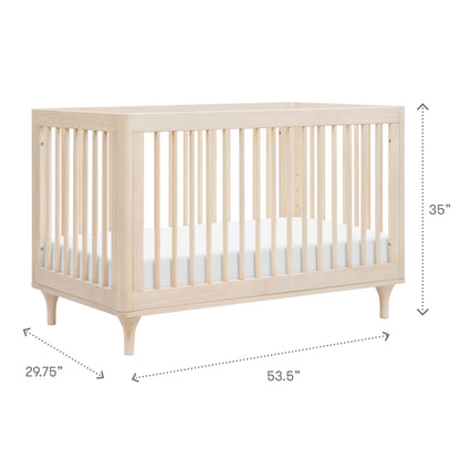 The Babyletto Lolly Convertible Crib features slatted sides and angled legs, made from New Zealand pine; measures 35" H x 53.5" W x 29.75" D. A white mattress fits perfectly inside.