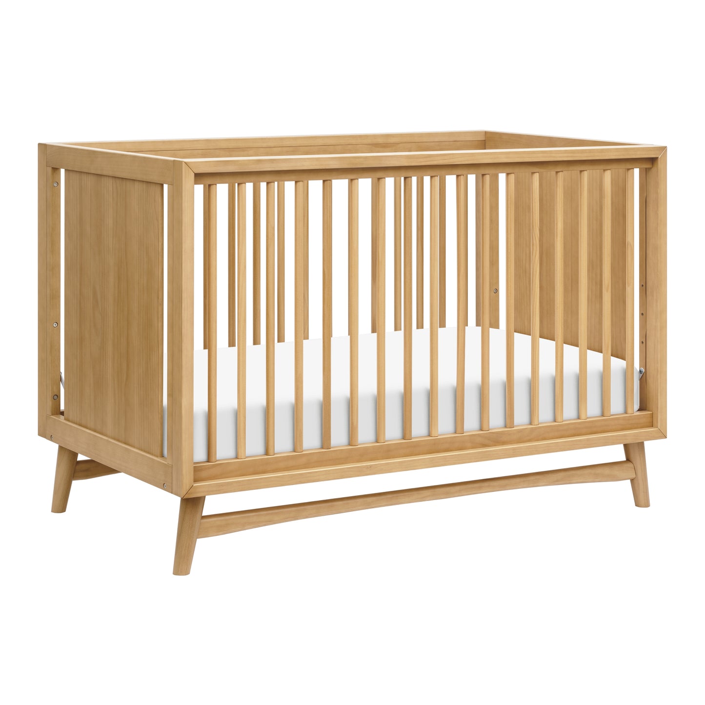 The Babyletto Peggy Convertible Crib features vertical slats on all sides, a white mattress, and angled legs—showcasing subtle mid-century style that's perfect for any modern nursery.