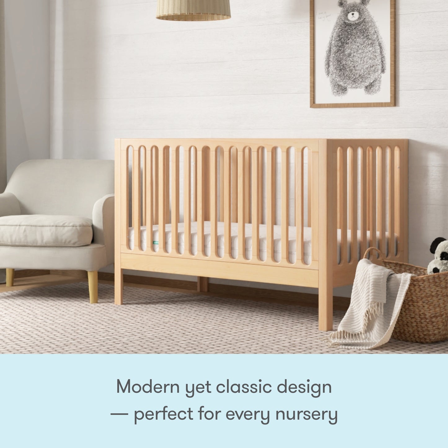 The Newton Galileo Convertible Crib by Newton Baby, with vertical slats and beech wood, brings modern yet classic style to any nursery. Easily converts to a toddler bed for growing kids—perfect beside your favorite armchair and blanket basket.
