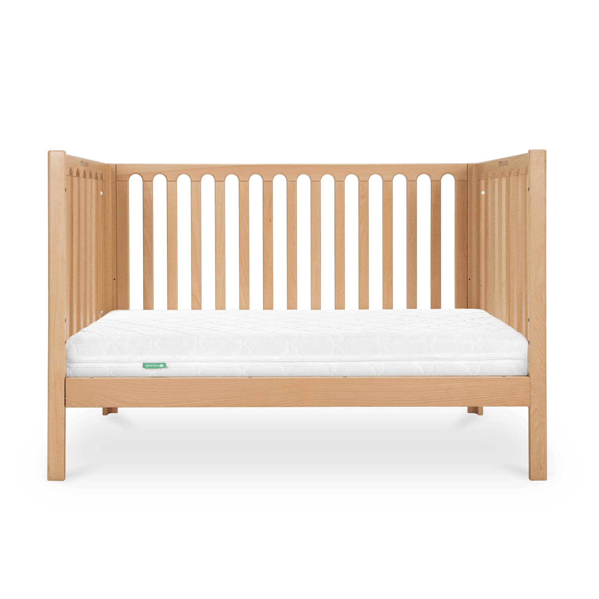 The Newton Baby Newton Galileo Convertible Crib features a natural light beech wood finish, vertical slats, simple modern design, and includes a white mattress. Easily converts to a toddler bed and is pictured against a plain white background.