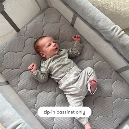 sleeping baby on bassinet insert with text "zip-in bassinet only" Bassinet Only