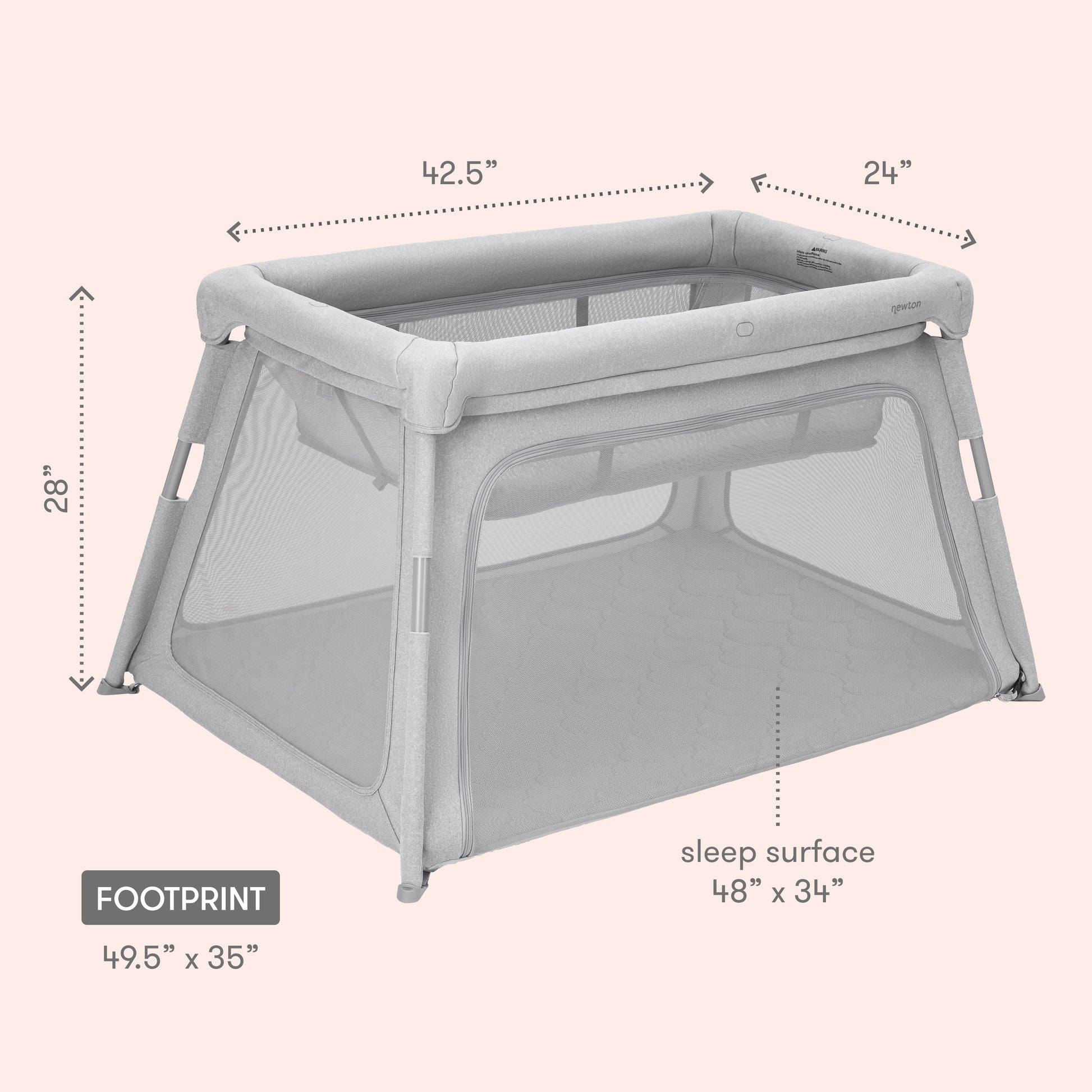 The Newton Baby Deluxe Travel Crib & Play Yard, in gray mesh, features a 48"x34" breathable crib mattress. The play yard measures 42.5"L x 24"W x 28"H with an overall footprint of 49.5"x35". Set against a light pink background.