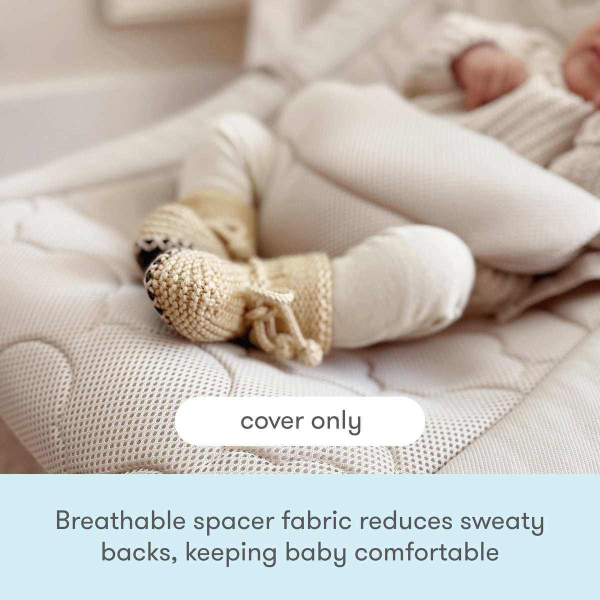 A baby wearing knit booties lies on a breathable, textured seat cover. Text reads: Cover only and Breathable spacer fabric reduces sweaty backs to keep your little one comfortable—upgrade your Newton Baby Rocker with the Newton Baby Rocker Extra Cover.