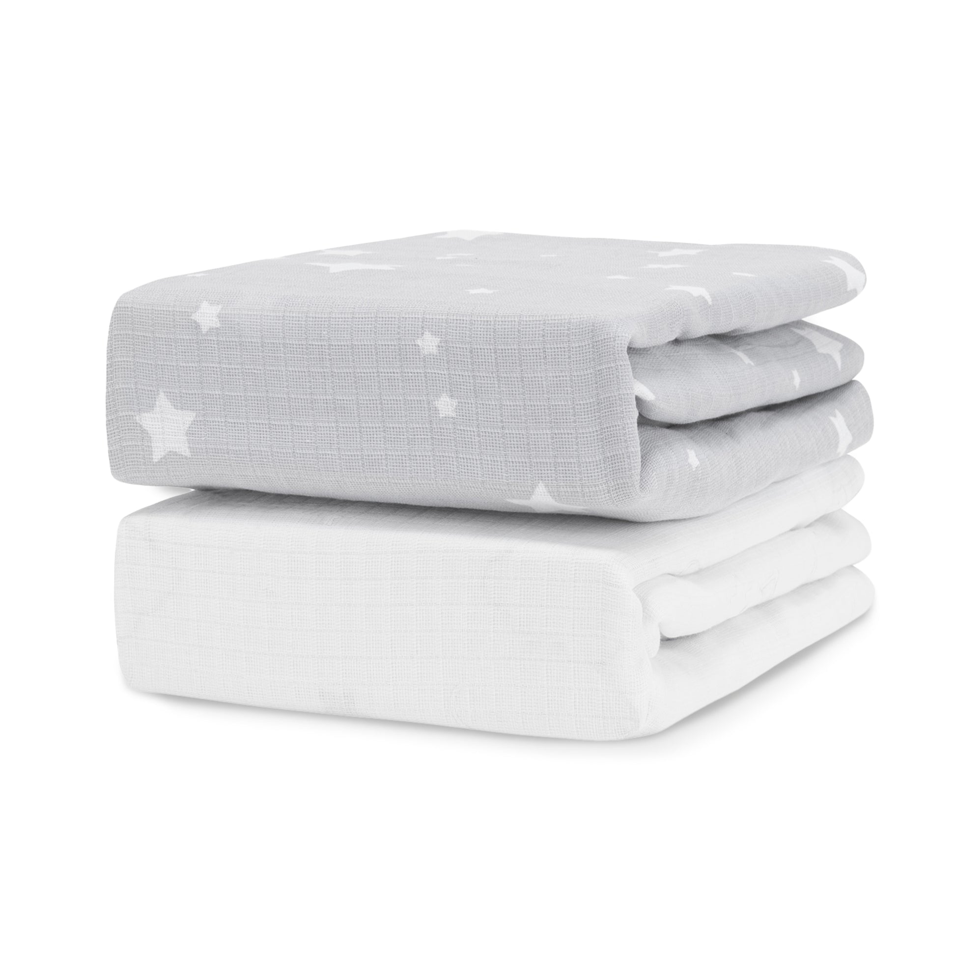 Two Newton Baby Breathable, Organic Cotton Sheets (2-pack) are stacked; the top is light gray with white stars and moons, while the bottom is solid white.