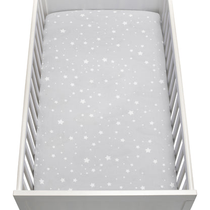 The Newton Baby Breathable, Organic Cotton Sheets (2-pack) include a light gray sheet with white stars in various sizes, made from soft, hypoallergenic fabric for your baby's comfort.