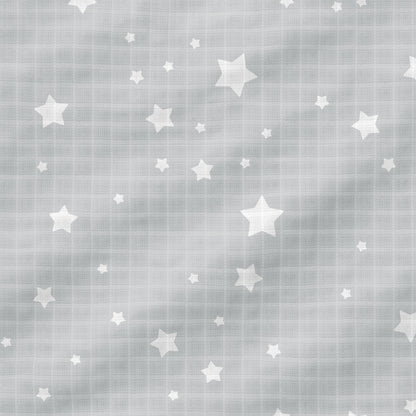 The Newton Baby Breathable, Organic Cotton Sheets (2-pack) feature light gray muslin with a grid pattern, a subtle wavy texture, and scattered white stars in various sizes for stylish comfort in your baby's crib.