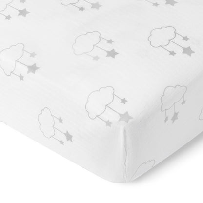 The Newton Baby Breathable, Organic Cotton Sheets (2-pack) feature a playful, minimal gray cloud and star design on white muslin. Soft, fitted, and organic, they wrap snugly around your crib mattress for style and breathability.