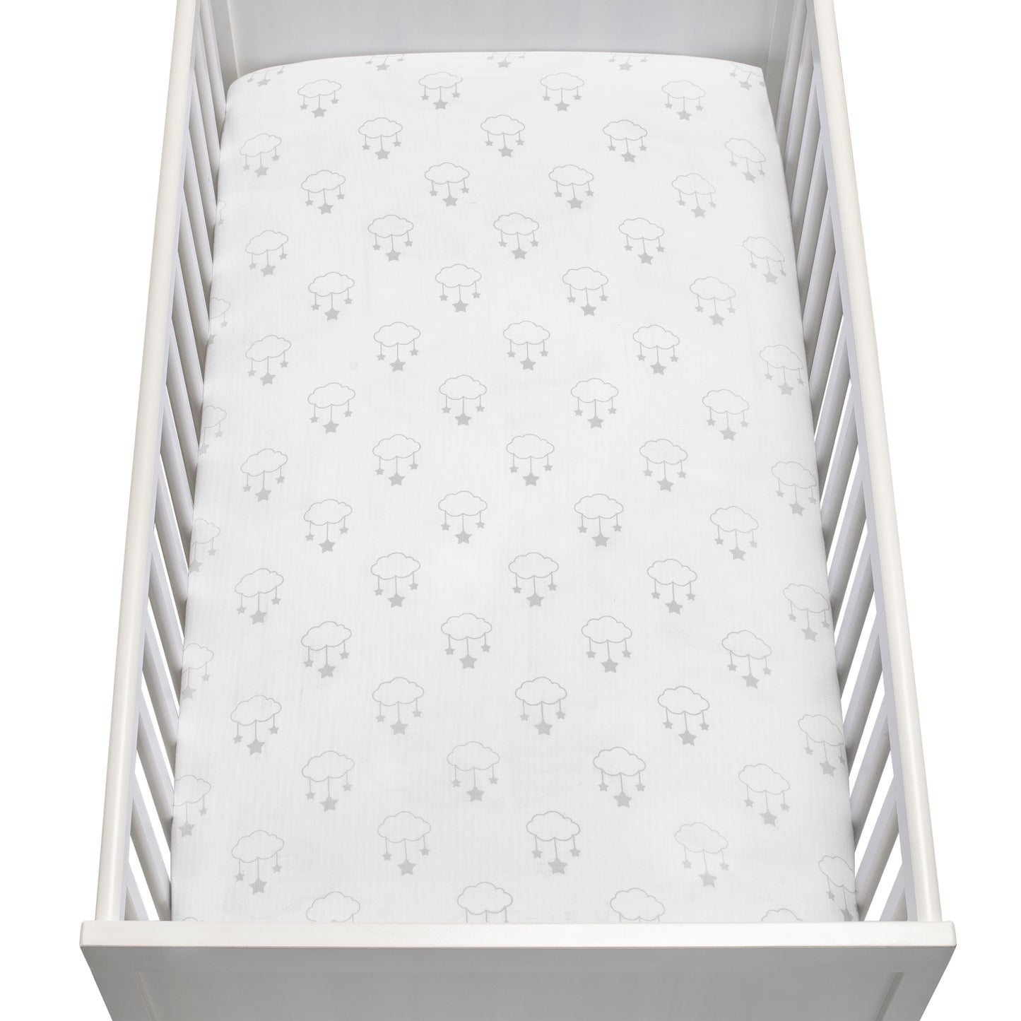 A white baby crib with vertical slats and a fitted sheet featuring a simple gray sheep pattern, viewed from above—made with Newton Baby's Breathable, Organic Cotton Sheets (2-pack) for a gentle and cozy sleep environment.