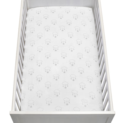 A white baby crib with vertical slats and a fitted sheet featuring a simple gray sheep pattern, viewed from above—made with Newton Baby's Breathable, Organic Cotton Sheets (2-pack) for a gentle and cozy sleep environment.