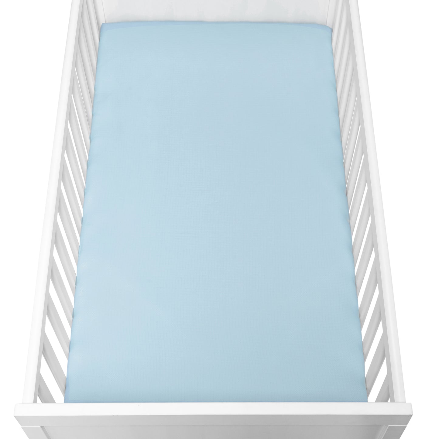 A white baby crib with vertical slats features a Newton Baby Breathable, Organic Cotton Sheet from the 2-pack, in light blue, covering the mattress and viewed from above.