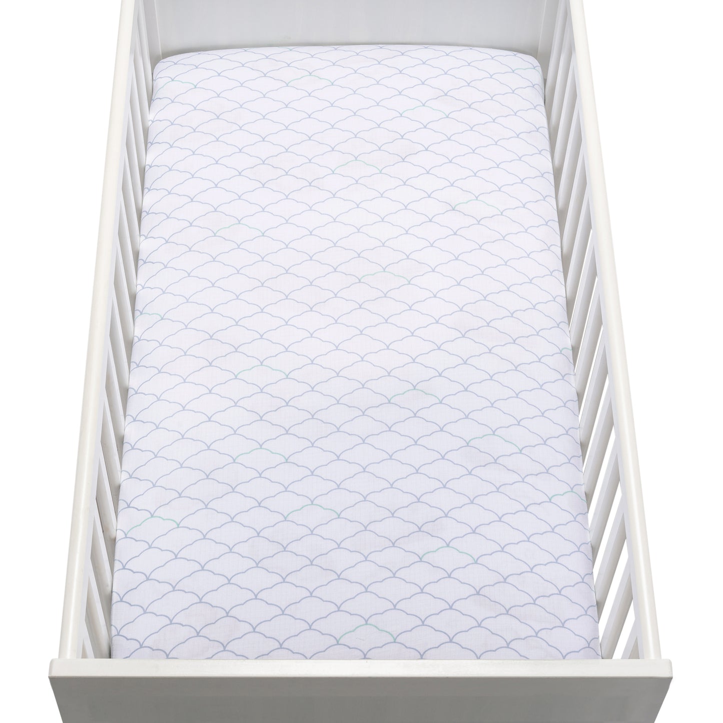 A white crib holds a mattress covered with a Newton Baby Breathable, Organic Cotton Sheet (2-pack) in white, featuring a subtle scalloped pattern. The photo is taken from above.