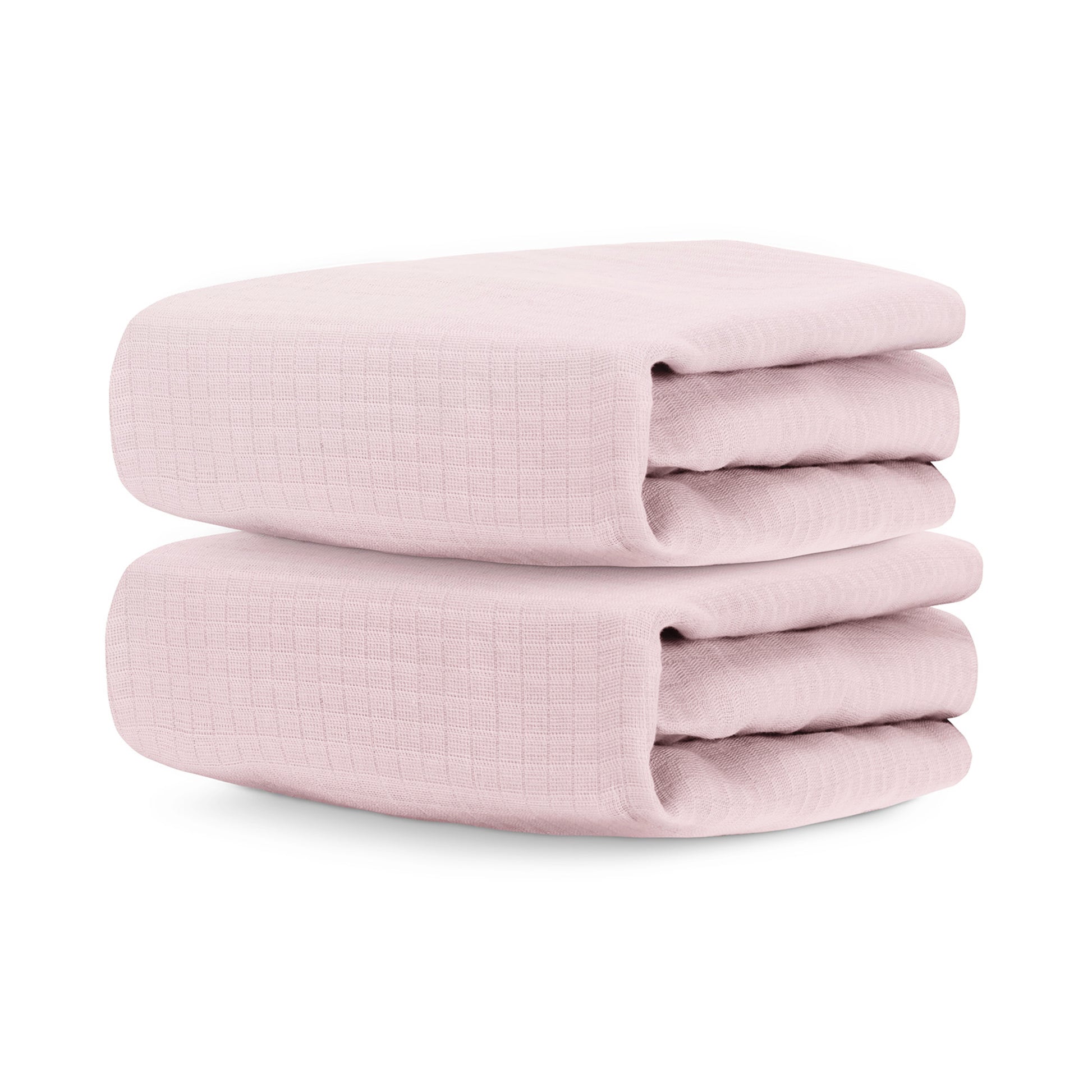 Two neatly folded Newton Baby Breathable, Organic Cotton Sheets (2-pack) in light pink with a subtle grid texture are stacked atop each other against a white background. 999-3020-PNP