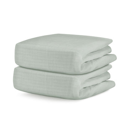 Folded light sage sheets on a white background. 999-3020-SNS