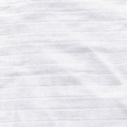 Close-up of Newton Baby Breathable, Organic Cotton Sheets (2-pack) in white muslin, featuring a subtle horizontal linear texture and soft, lightweight look.