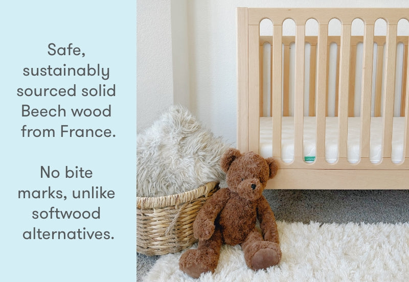 A cozy nursery scene featuring a plush teddy bear sitting beside a crib made of sustainably sourced solid Beech wood from France, with text explaining the wood's durability and safety.