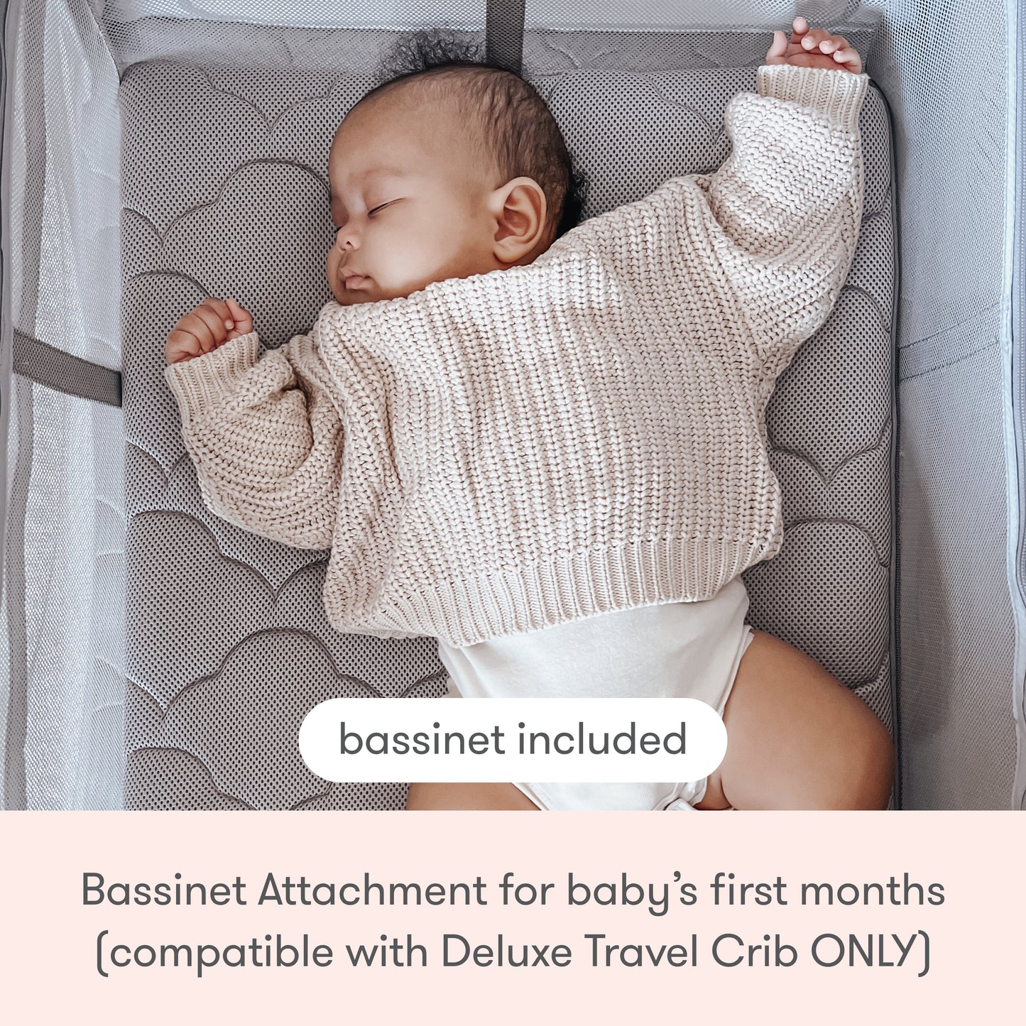 A baby sleeps on a padded, breathable mattress in the Newton Baby Deluxe Travel Crib & Play Yard with included bassinet attachment for your baby's first months.