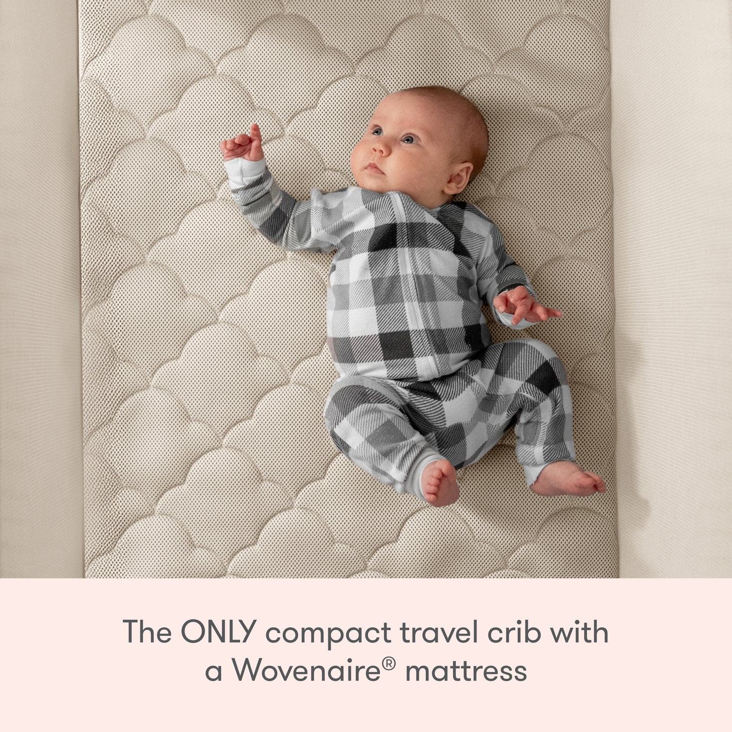 A baby in a black, white, and gray plaid outfit lies on a textured crib mattress. Text below reads: Newton Baby Compact Travel Crib & Play Yard—the only compact travel crib with a breathable Wovenaire® mattress.