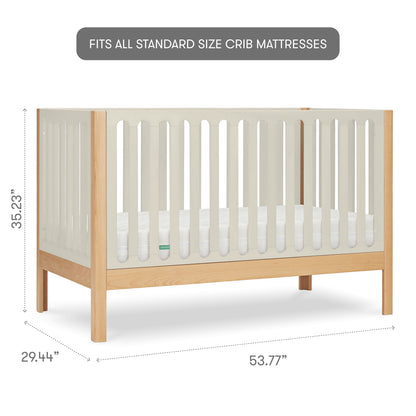 The Newton Baby Galileo Convertible Crib is shown in beech wood with light slats and a natural frame, measuring 35.23"H x 29.44"W x 53.77"L. Fits all standard crib mattresses; compatible with a toddler bed conversion kit.