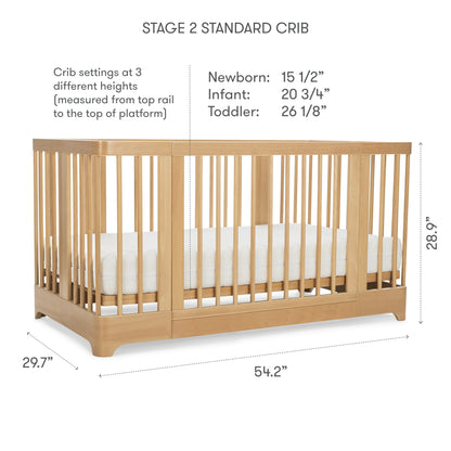 The Newton Nest Convertible Crib by Newton Baby features light wood, slatted sides, a white mattress, and GREENGUARD Gold certification. Adjustable mattress heights are 15.5", 20.75", and 26.125". Dimensions: 54.2"W x 29.7"D x 28.9"H.