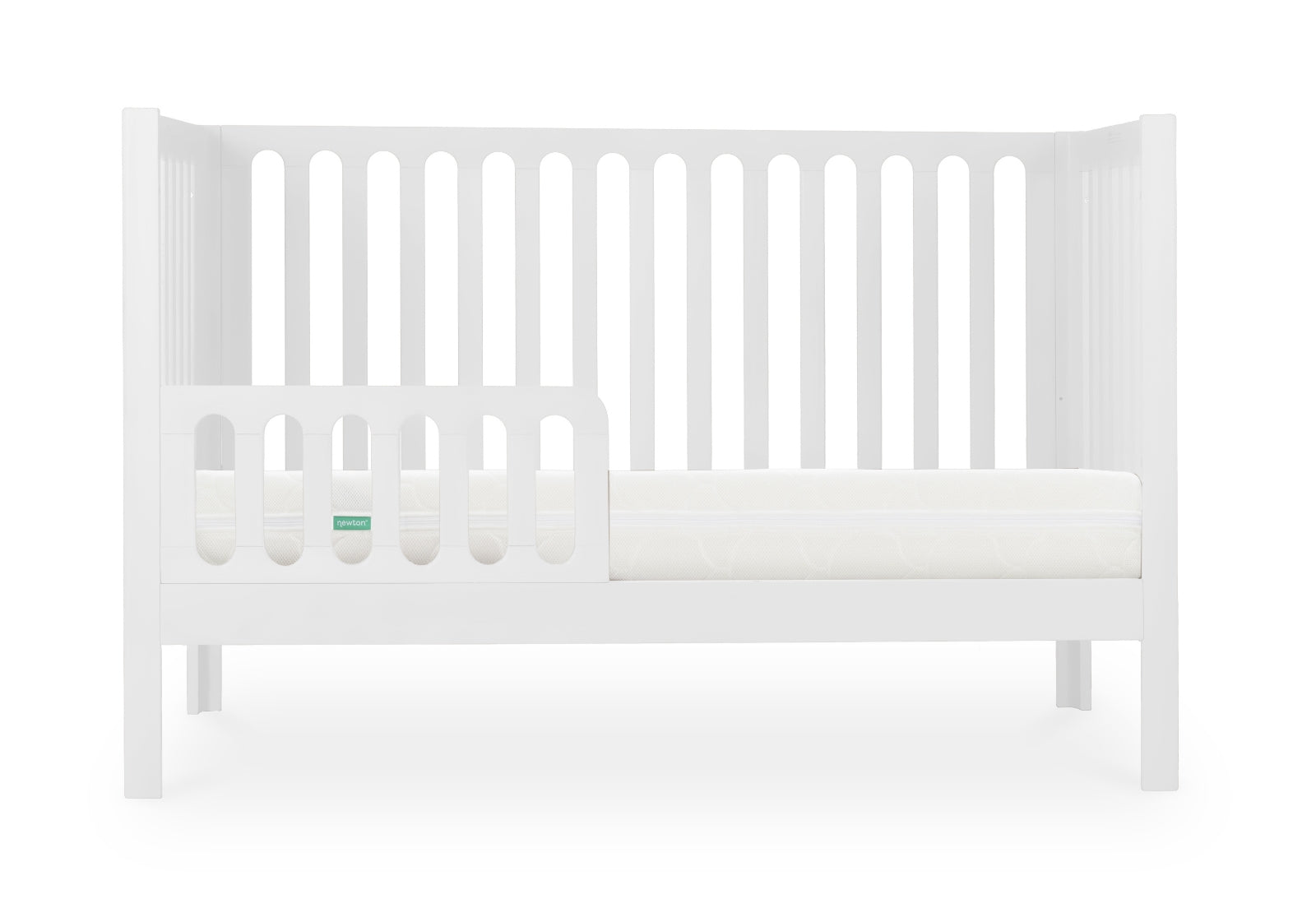 White modern baby crib with a Newton mattress visible, styled with minimalistic design on a plain background.