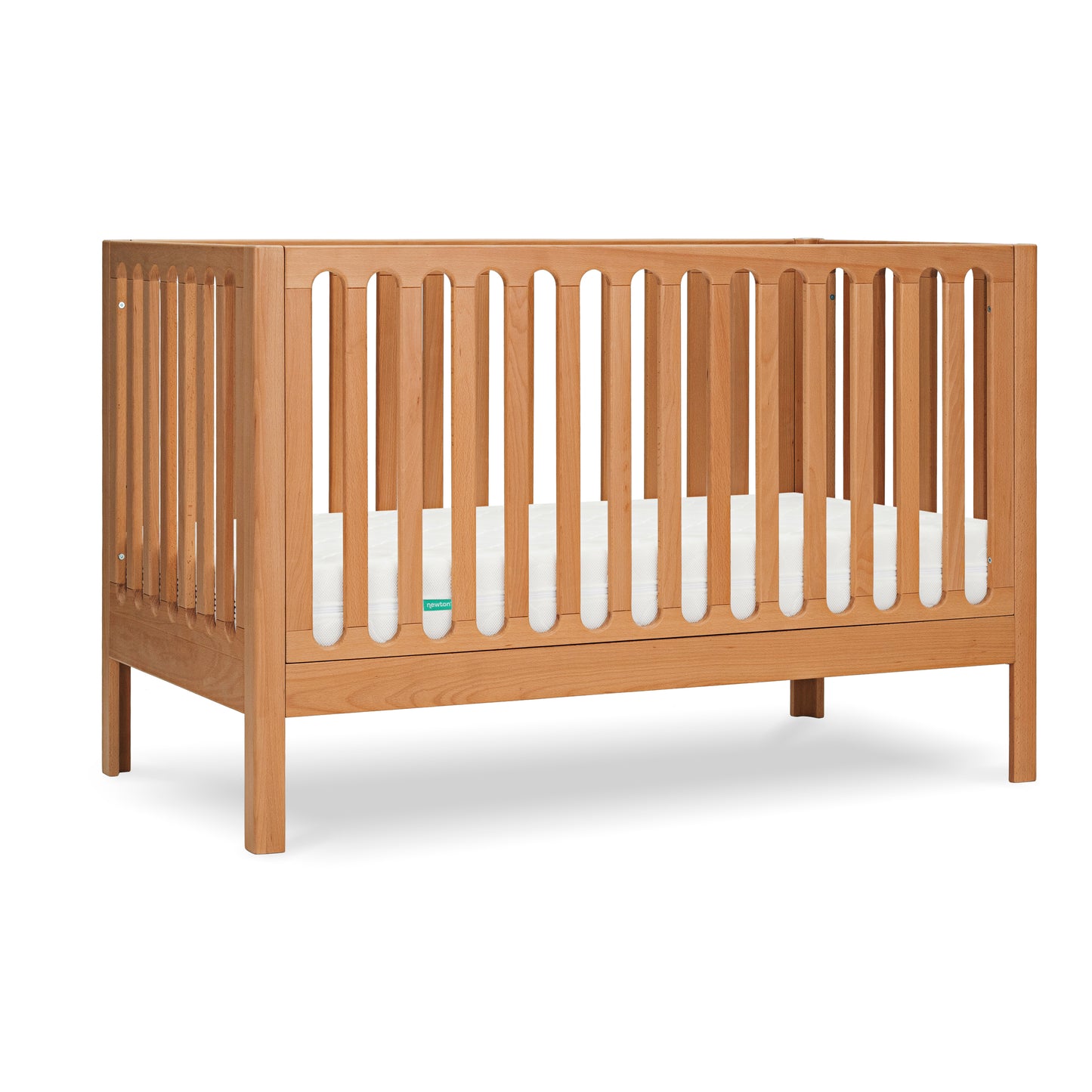 The Newton Galileo Convertible Crib by Newton Baby features beech wood and vertical slats on all sides, includes a white mattress, and easily converts into a toddler bed as your child grows.