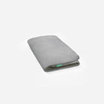 Gray Newton baby mattress folded in half on a white background.