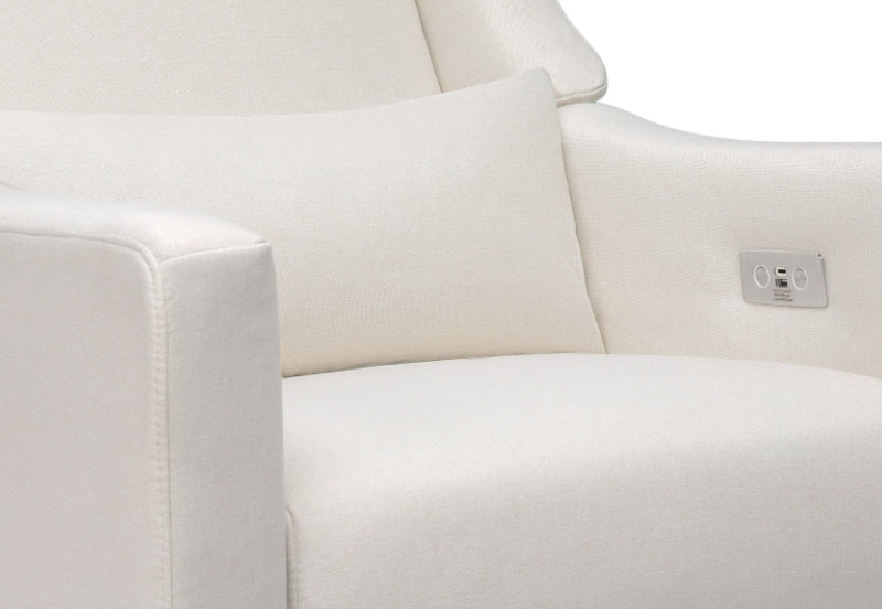 Close-up of a cream-colored nursery recliner with plush cushions and built-in USB port.