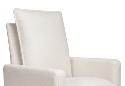 Close-up of a modern beige nursery rocking chair with a high back and padded armrests.