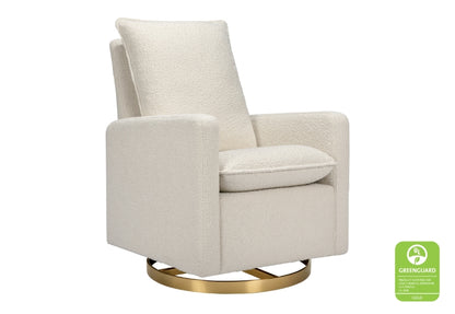 Beige upholstered chair with a modern design and a golden circular base, featuring a small green "GREENGUARD" certification label on the bottom right.