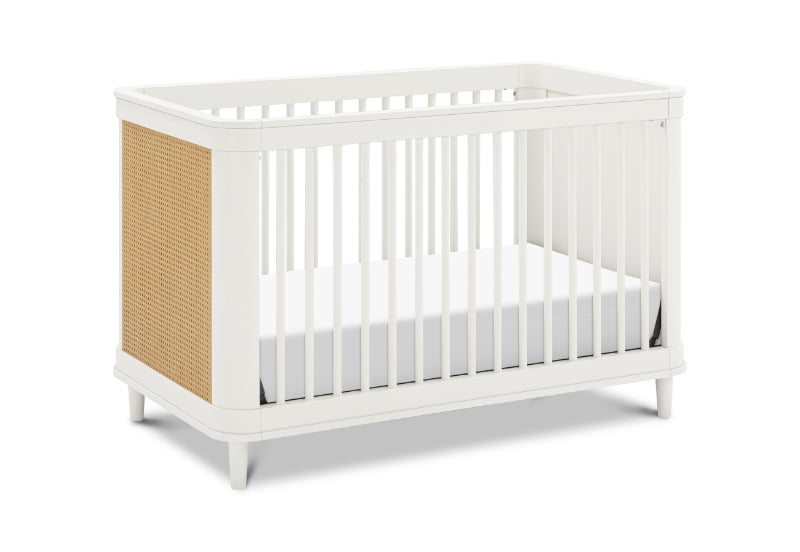 White baby crib with a breathable, beige side panel, shown on a white background.