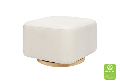 A modern, round white ottoman on a wooden base with a green "Greenguard" certification badge visible in the corner.