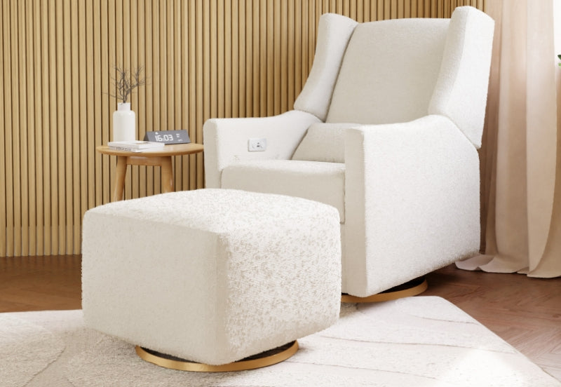 A cozy nursery featuring a modern white rocking chair and matching ottoman set against a bamboo paneled wall and neutral decor, with a digital clock showing "16:03" on a small wooden side table.
