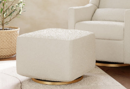 A modern white nursery glider and ottoman set in a cozy room corner with soft lighting and a potted plant.